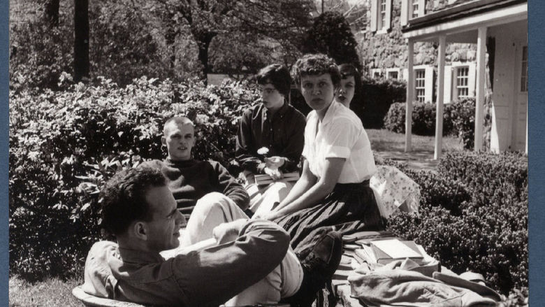 Students relax outside Glenhill Farmhouse in the early days of Behrend Center