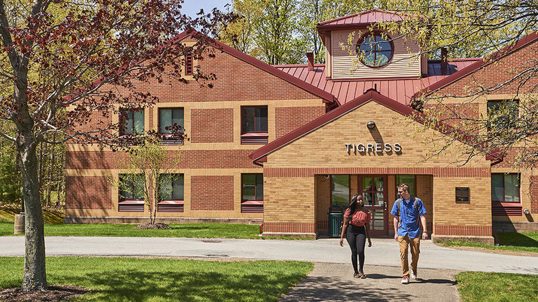 Two students walking outside of Tigress Hall on Behrend campus