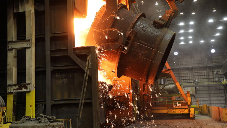 A ladle of molten iron is poured into a U.S. Steel blast furnace.