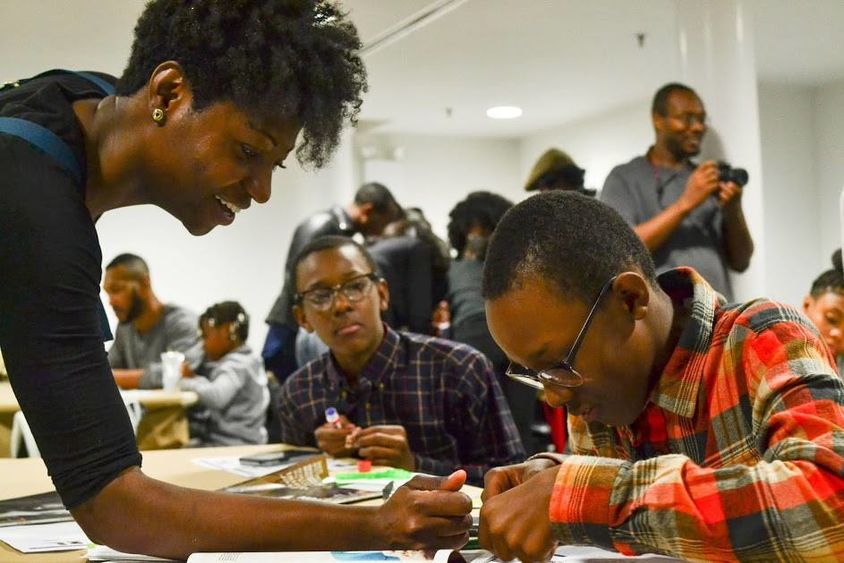 Jacqueline Jackson works with two boys during a mentoring session.