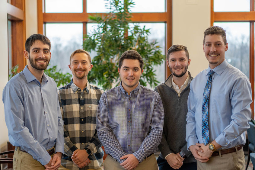 Five Penn State Behrend students pose in Metzgar Center.