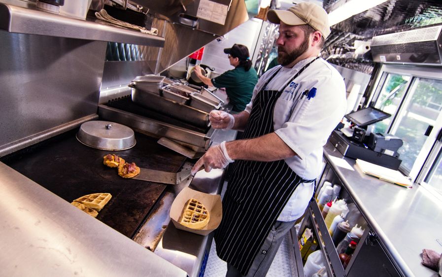 Chef James Nicosia works inside the Behrend Clipper food truck