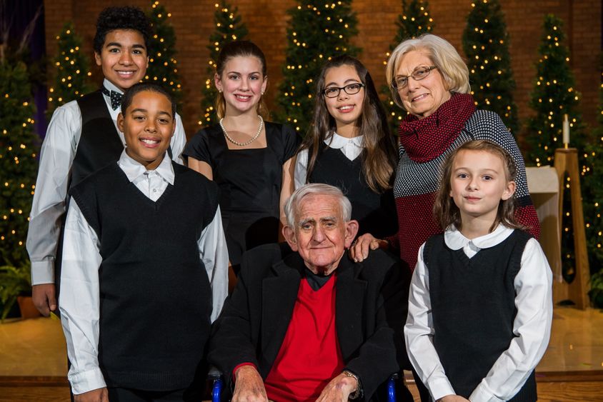 Bill and Martha Hilbert pose with members of the Young People's Chorus of Erie