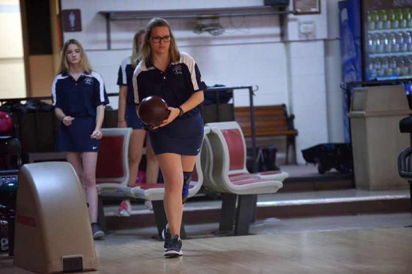 A Penn State Behrend bowler prepares to roll the ball.