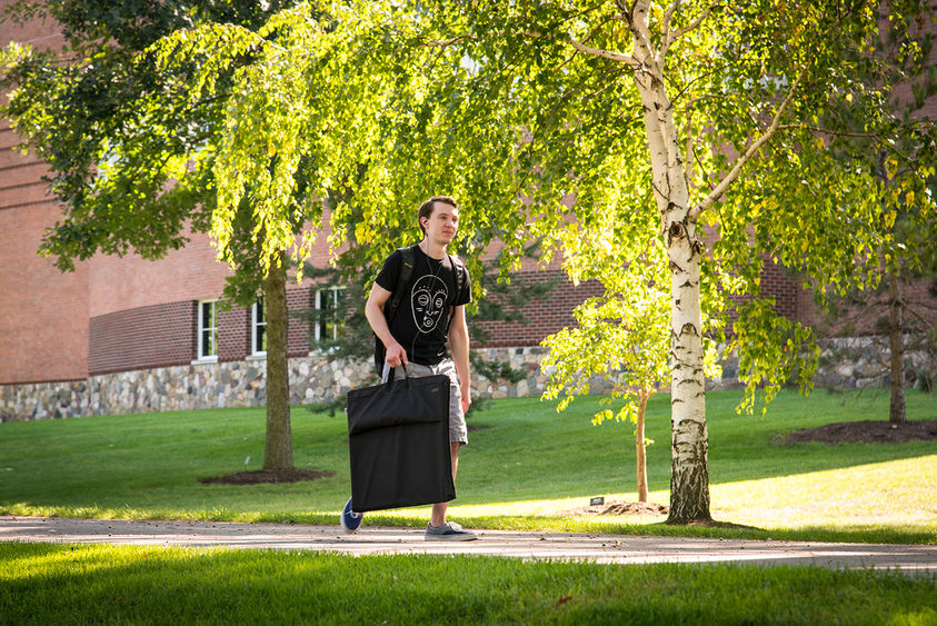 Student walking outside Lilley Library