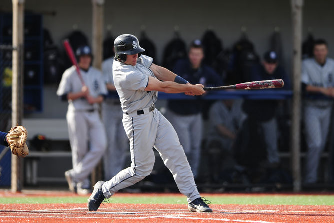 Penn State Behrend baseball player Brian Bohman hits the ball.