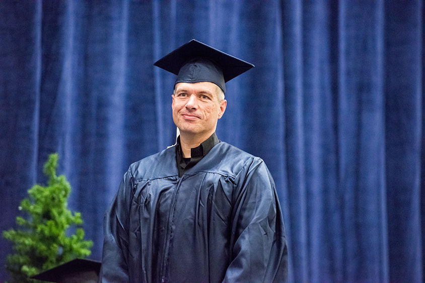 Adult graduate in cap and gown