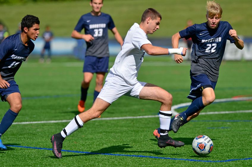 Penn State Behrend soccer player Richard Blanchard advances the ball