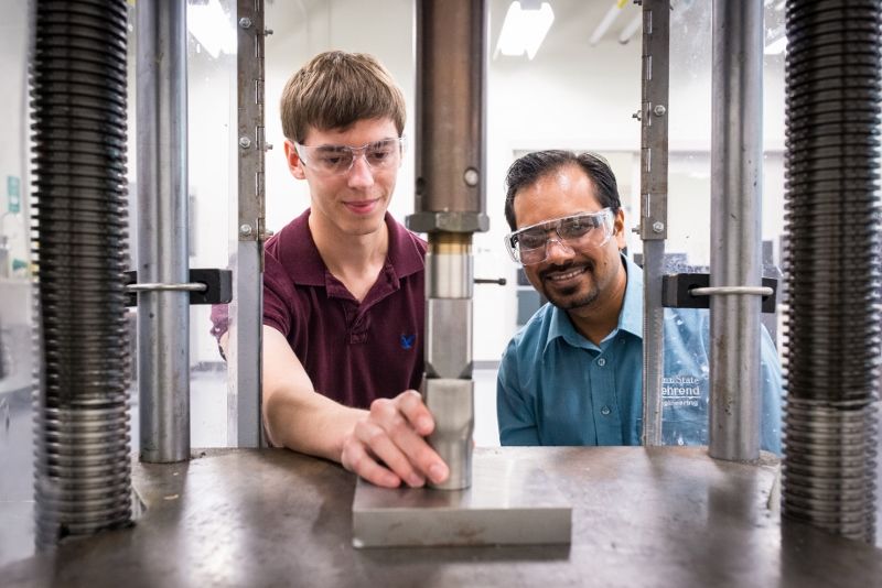 A professor works with a student in an engineering lab at Penn State Behrend.