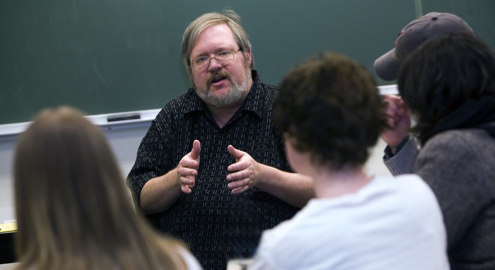 Penn State Behrend professor George Looney in a classroom with students