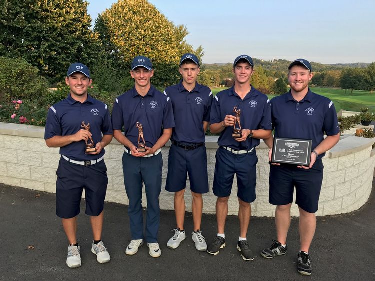 Members of the Penn State Behrend men's golf team post with trophies after the La Roche invitational