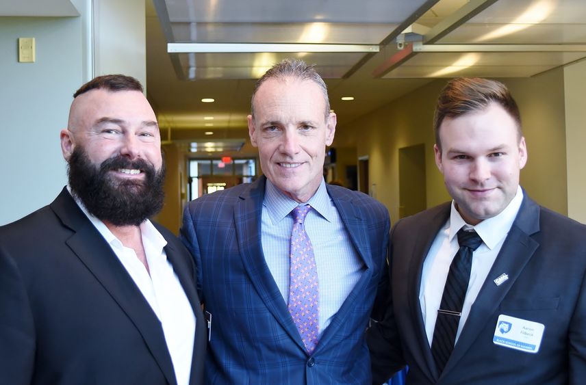 Greg Filbeck, William Kelly and Aaron Filbeck pose for a photo at the Finance Day program at Penn State Behrend's Burke Center.