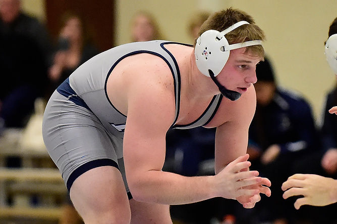 Penn State Behrend wrestler Jake Paulson competes in a match.