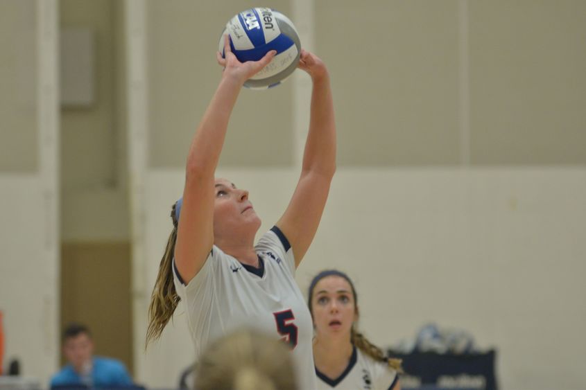 Penn State Behrend volleyball player Lexi Irwin sets the ball.