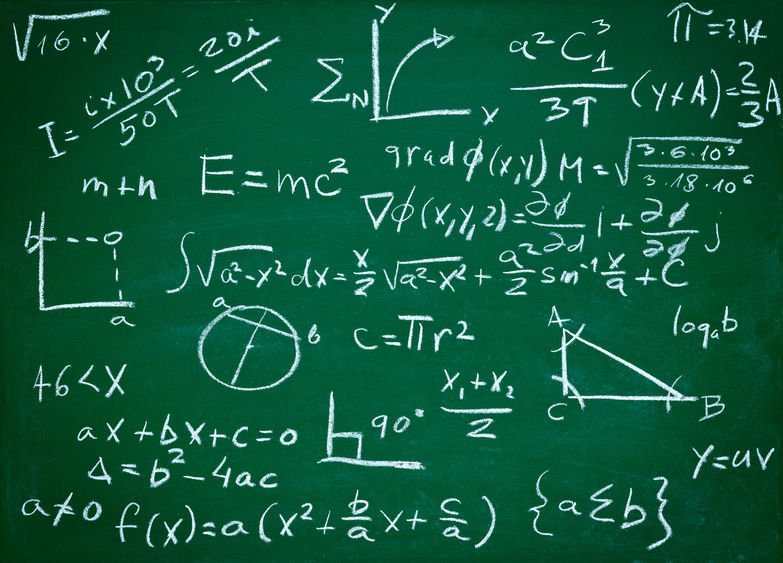 A close-up of math equations on a blackboard.