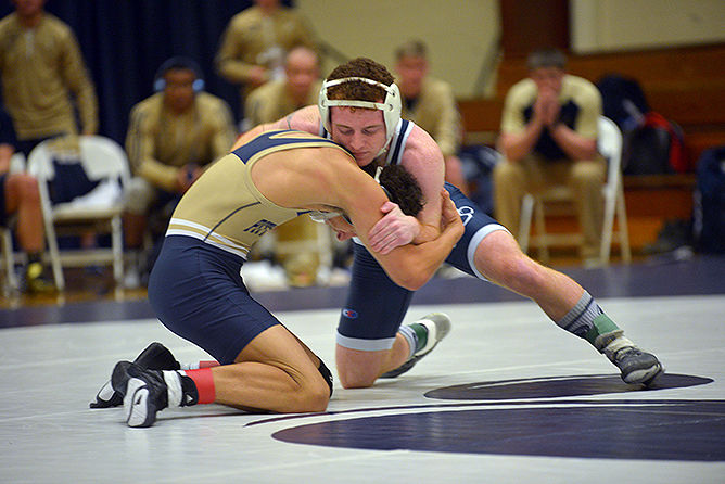 Penn State Behrend wrestler Michael Binni grapples with an opponent.