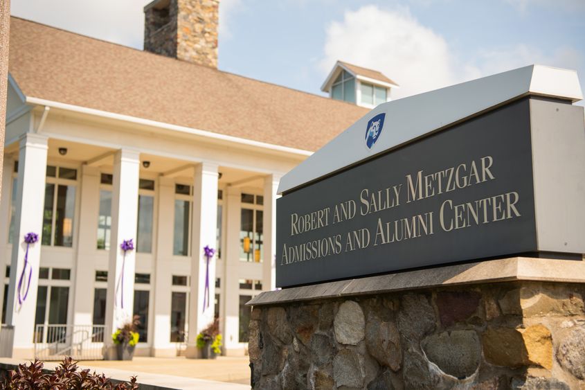 Purple ribbons hang on the pillars of Penn State Behrend's Metzgar Center