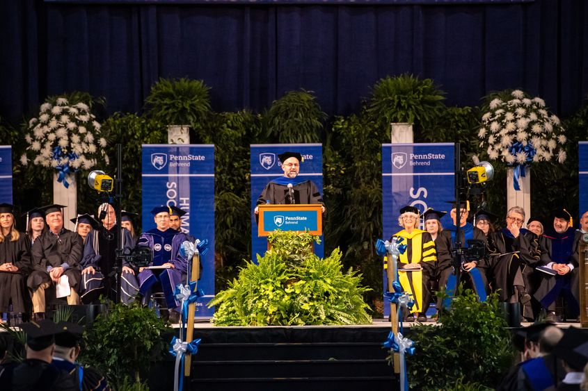 Mike Rutter, associate professor of statistics, speaks at Penn State Behrend's spring commencement ceremony.