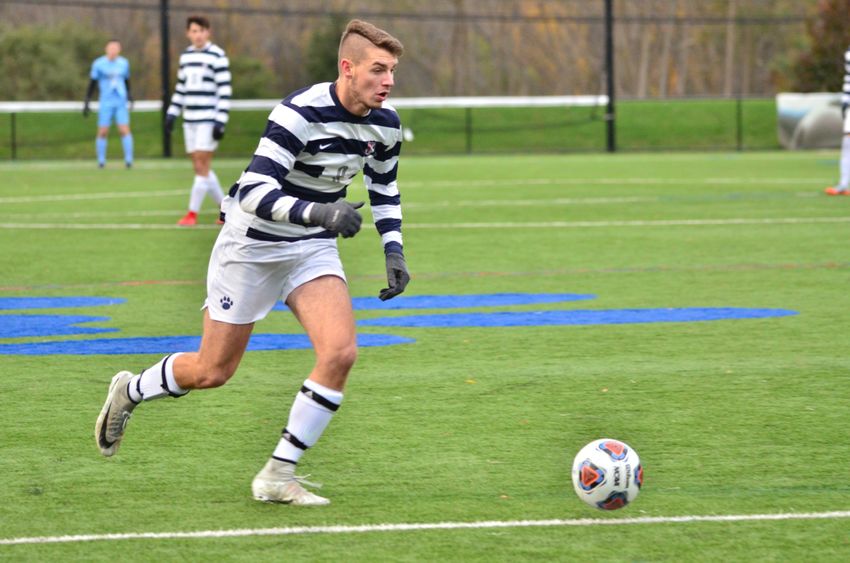 Penn State Behrend soccer player Richard Blanchard prepares to kick the ball