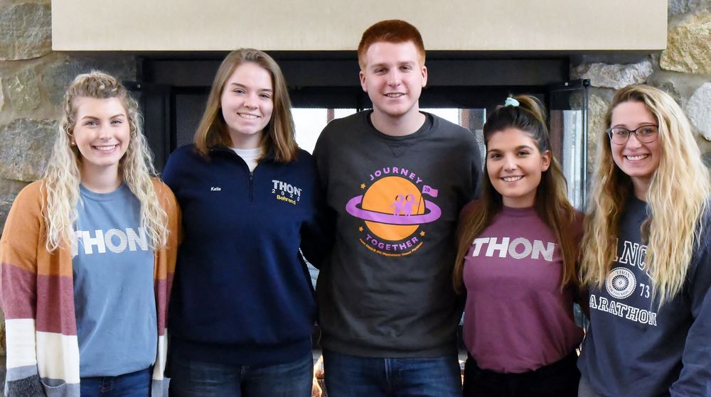 Five Penn State Behrend students pose for a group photo before THON.