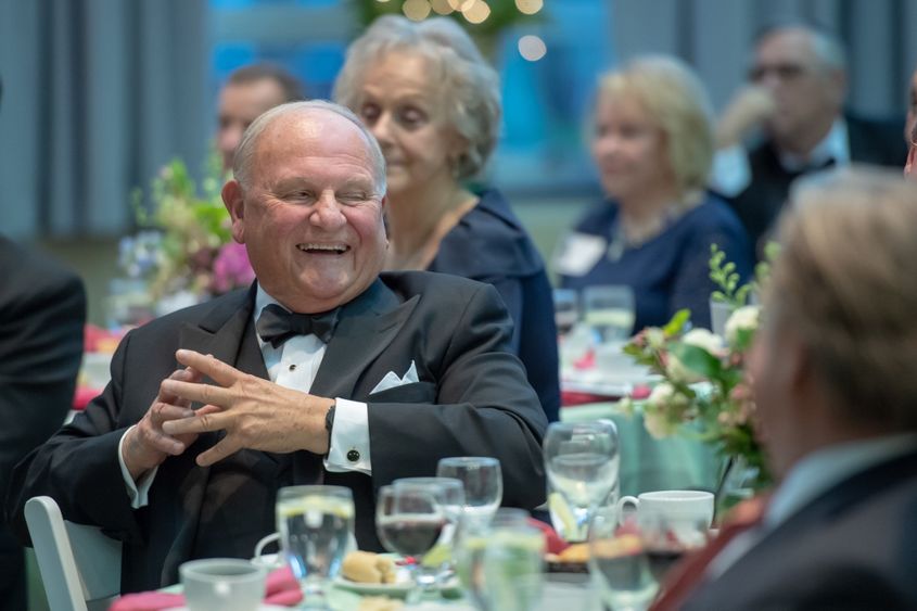 Tom Hagen reacts to remarks during a ceremony honoring him on May 23.