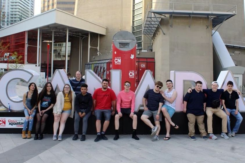 A group of Penn State Behrend students pose outside the CN Tower in Toronto.