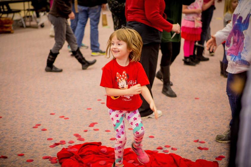 A young participant enjoys the Hearts and Showers activity during the Valentine's Day Extravaganza, held Saturday, Feb. 10, at North East School District’s Earle C. Davis Primary school. 