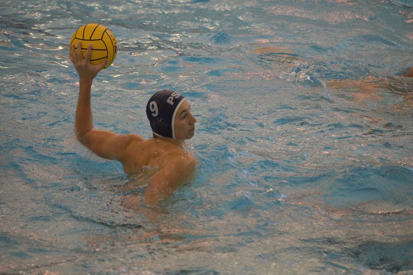 A Penn State Behrend water polo player prepares to throw the ball.