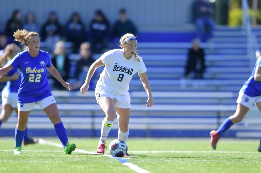 A Penn State Behrend soccer player advances toward the goal.