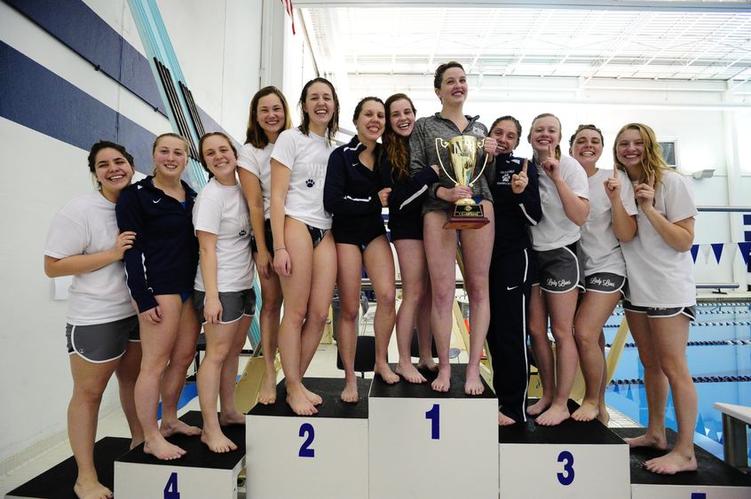 The Penn State Behrend women's swim team on the AMCC medal stand