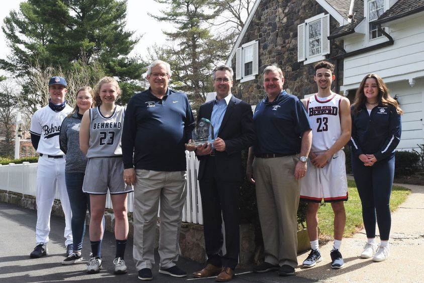 Penn State Behrend students and Chancellor Ralph Ford pose with the AMCC Institutional Peak Performer Award