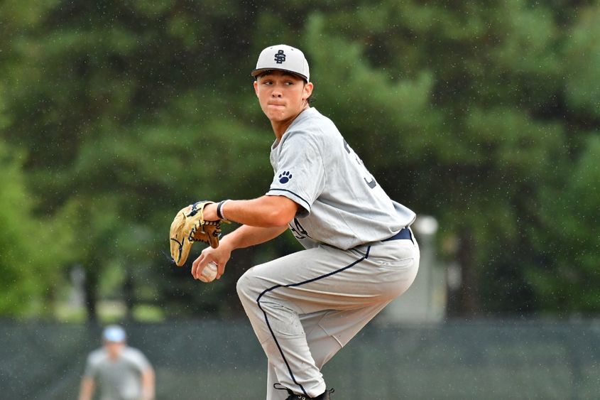 A pitcher for the Penn State Behrend baseball team prepares to throw the ball.