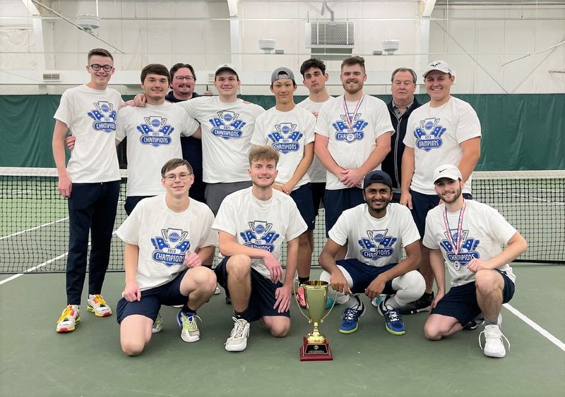 The Penn State Behrend men's tennis team poses with the trophy after winning the AMCC championship.