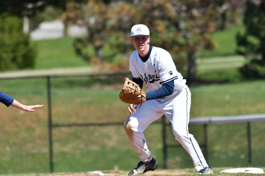 An infielder for the Penn State Behrend baseball team prepares to field the ball.