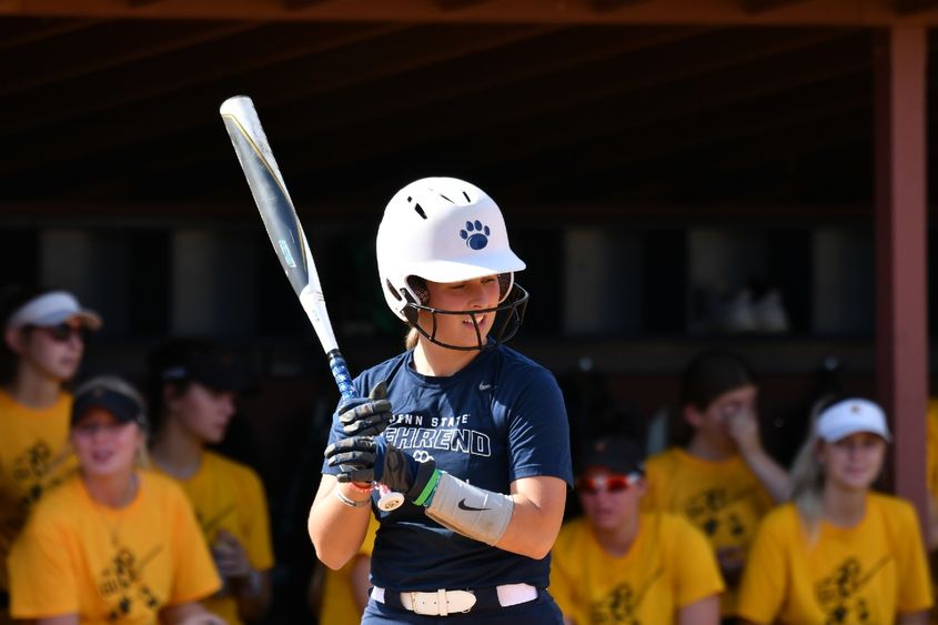 A Penn State Behrend softball player stands in the batter's box.