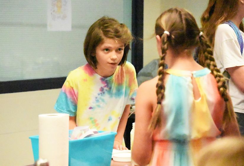 A 12-year-old girl interviews another student during a Penn State Behrend College for Kids program.