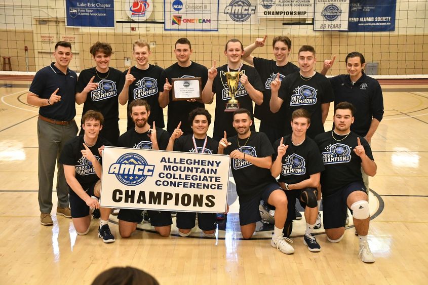 The Penn State Behrend men's volleyball team celebrates after winning the AMCC championship.