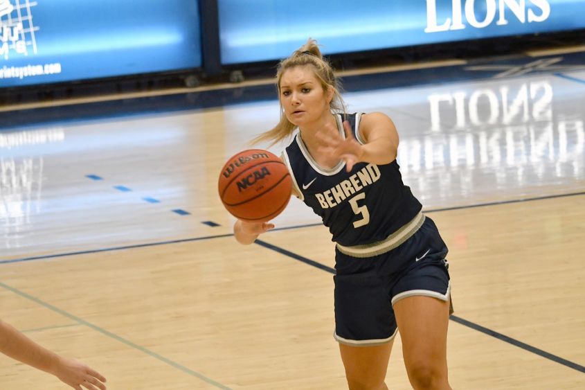 Penn State Behrend basketball player Rachel Majewski passes the ball.