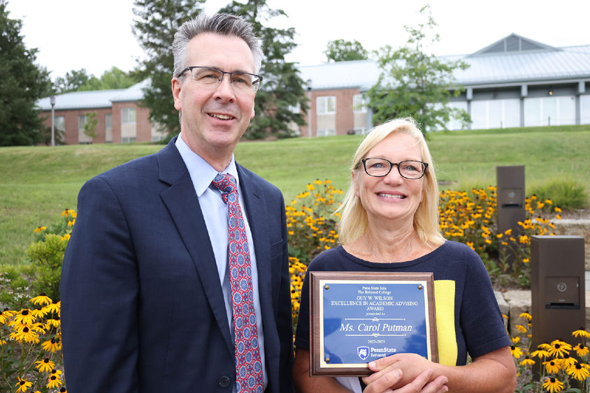 Penn State Behrend Chancellor Ralph Ford poses with Carol Putman, associate teaching professor of management