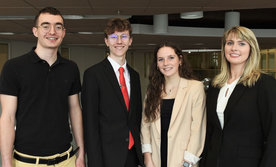 Four members of the Penn State Behrend CFA Institute Research Challenge team pose in Burke Center.