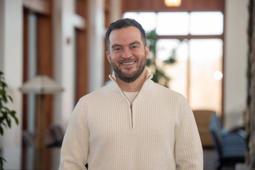 A portrait of Alumni Achievement Award recipient Connor Sattely