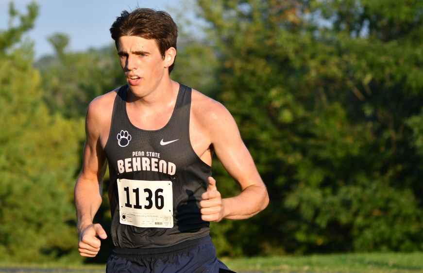 Penn State Behrend runner Phoenix Myers competes in an 8K race.