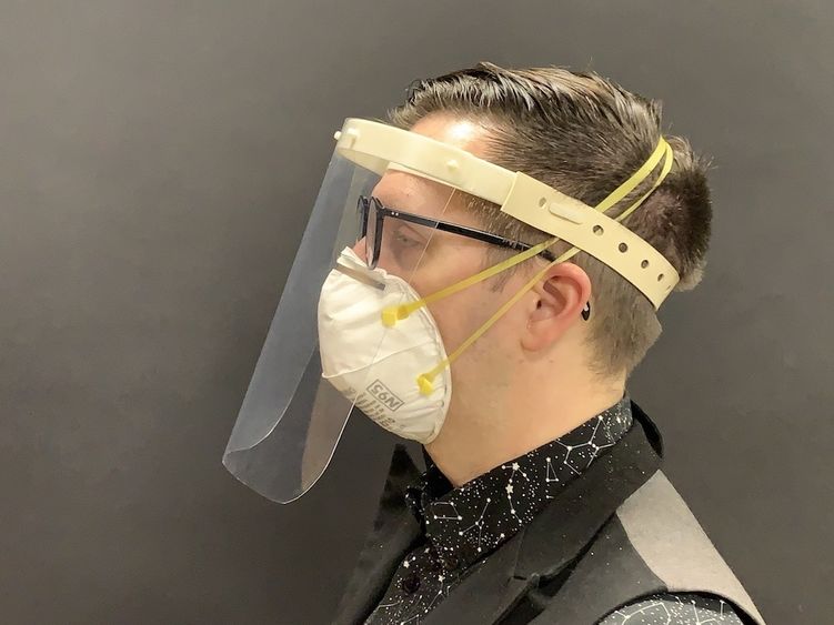 A product designer models the White Label Face Shield