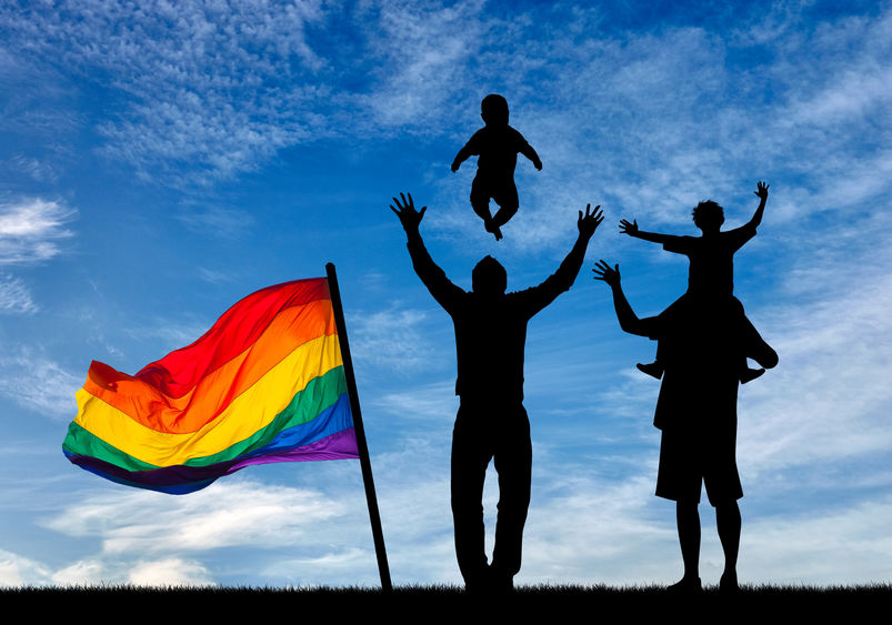 Image of gay fathers with child.