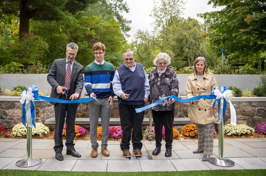 Five guests cut a dedication ribbon at the new Glenhill Gardens at Penn State Behrend