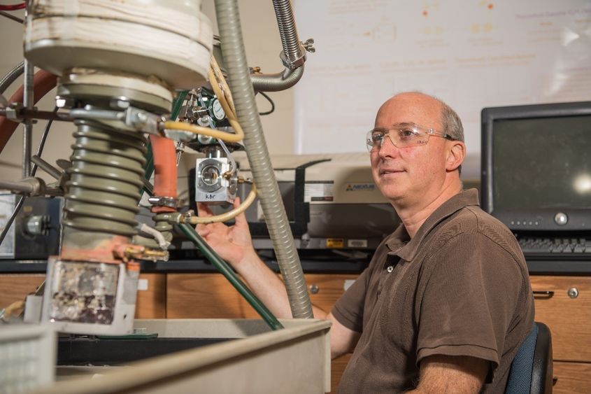 Jay Amicangelo, professor of chemistry at Penn State Behrend, works in his lab at the college.