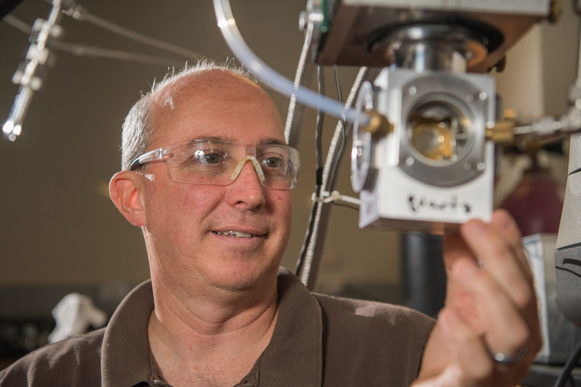 Jay Amicangelo, professor of chemistry at Penn State Behrend, works in the lab.