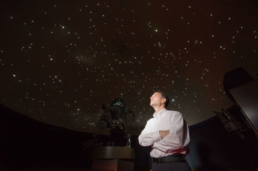 Jim Gavio Jim Gavio, director of Yahn Planetarium, looks up at the starfield on the planetarium's ceiling.