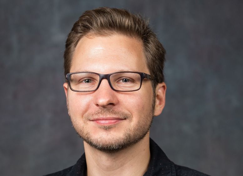 A portrait of Joel Hunt, associate teaching professor of music at Penn State Behrend