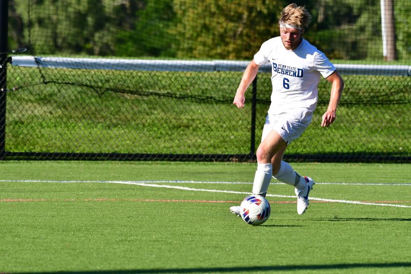 Penn State Behrend soccer player Jonathan Swann prepares to kick the ball.